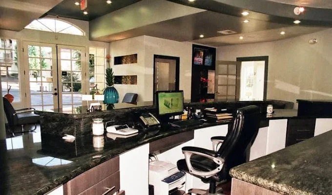 Front desk reception area at Agoura Advanced Dentistry with computer and phone