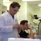 Dentist examining a patient's teeth at European Denture Center in Caldwell, ID
