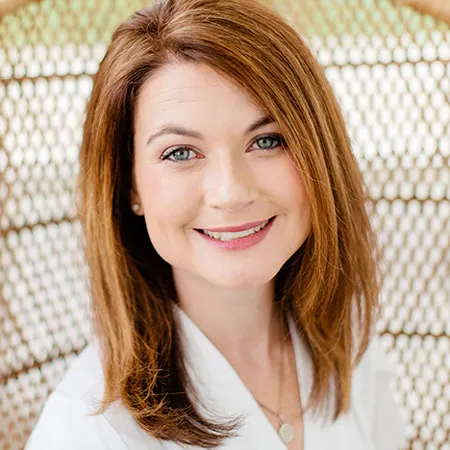 Portrait of a female dentist in a white coat at Springfield Smile Doctor