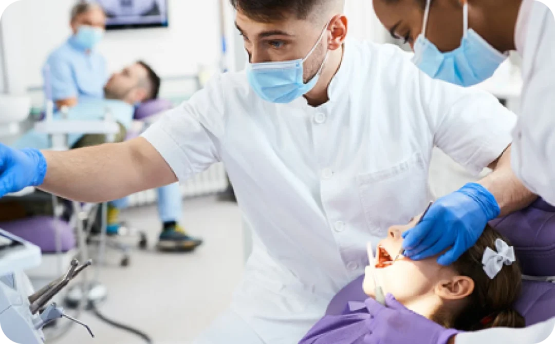 Dentist treating a young patient in the dental chair at Smile4Ever Family Dentistry in Houston