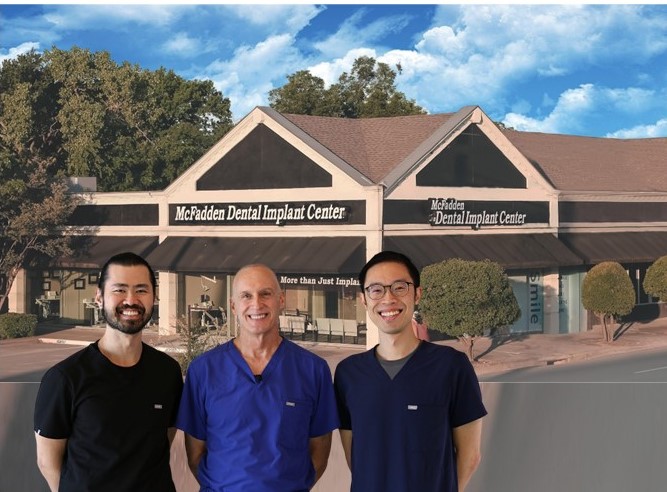 Team of three dentists standing outside McFadden Dental Implant Center building in Dallas, TX