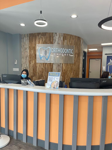 Reception desk with staff member at Orthodontic Experts in Arlington Heights, IL
