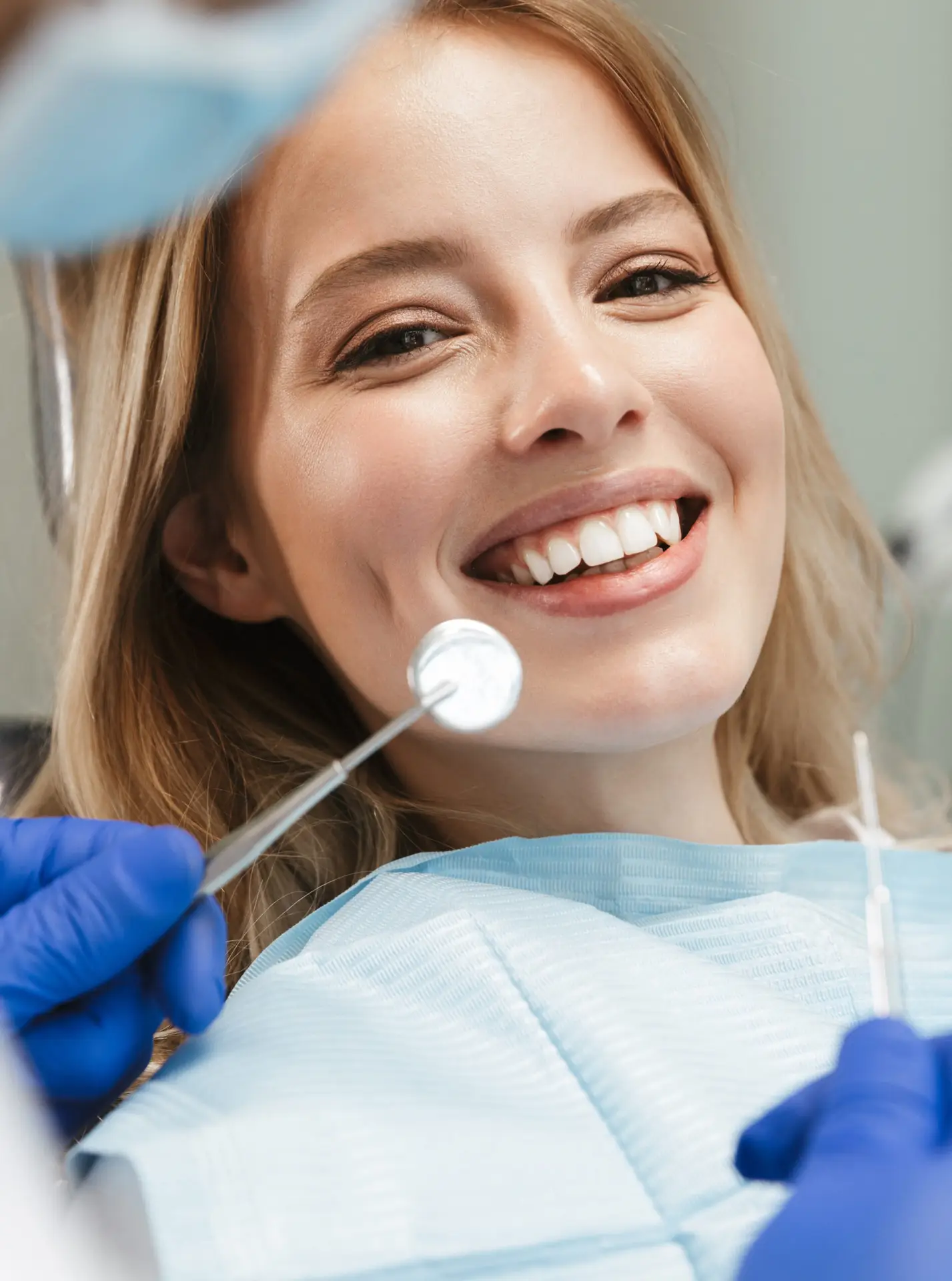 Smiling female patient during a dental checkup at Heart Mountain Dental