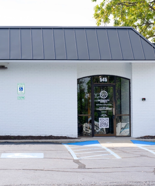 Exterior entrance of Orthodontic Experts of Indiana in Munster, IN, with signage at 545.
