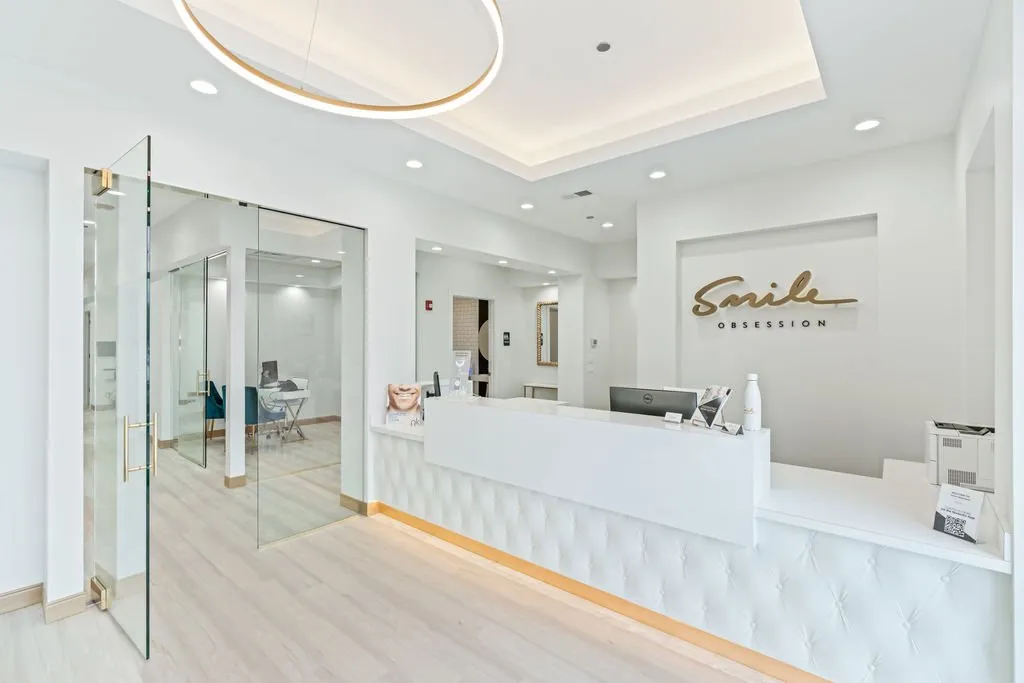 Front desk and glass-walled consultation room at Smile Obsession in Naperville