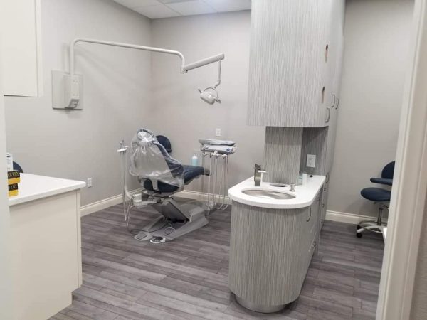 Treatment room with dental chair and sink at Your Smile Designer Dental Menifee & Orthodontics