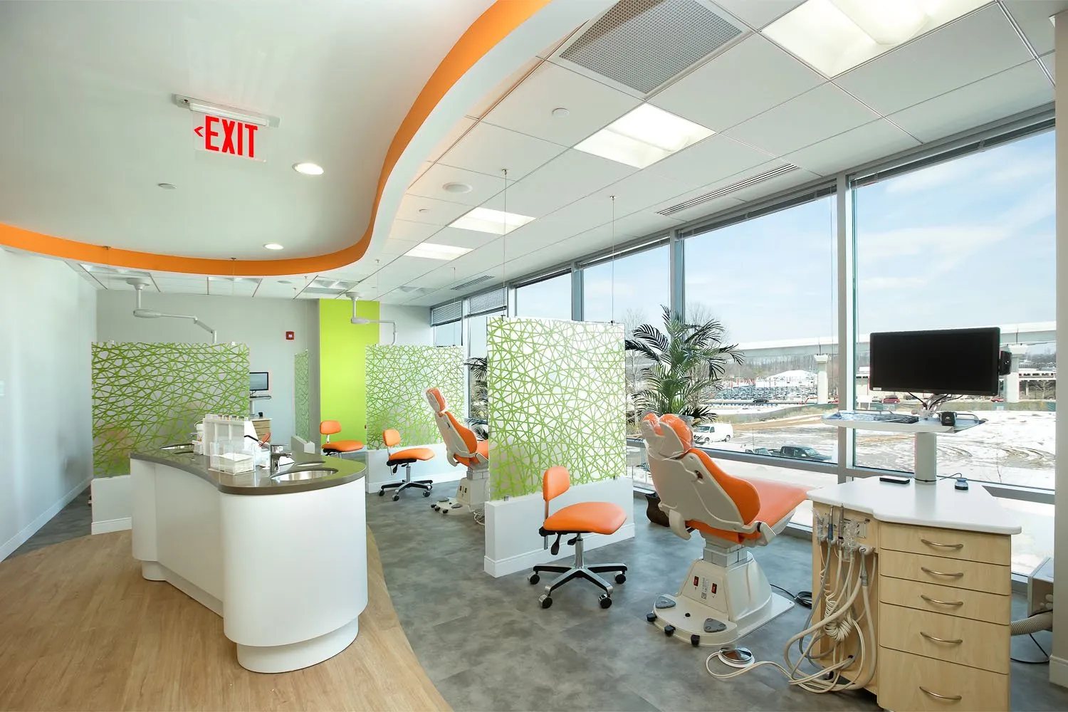 Treatment bay with orthodontic chairs and large windows at Tysons West Orthodontics & Children's Dentistry in Vienna, VA