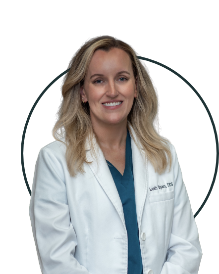 Dr. Leah Byars, DDS, smiling in white coat at Sunset Hills Dental Co. of Reston