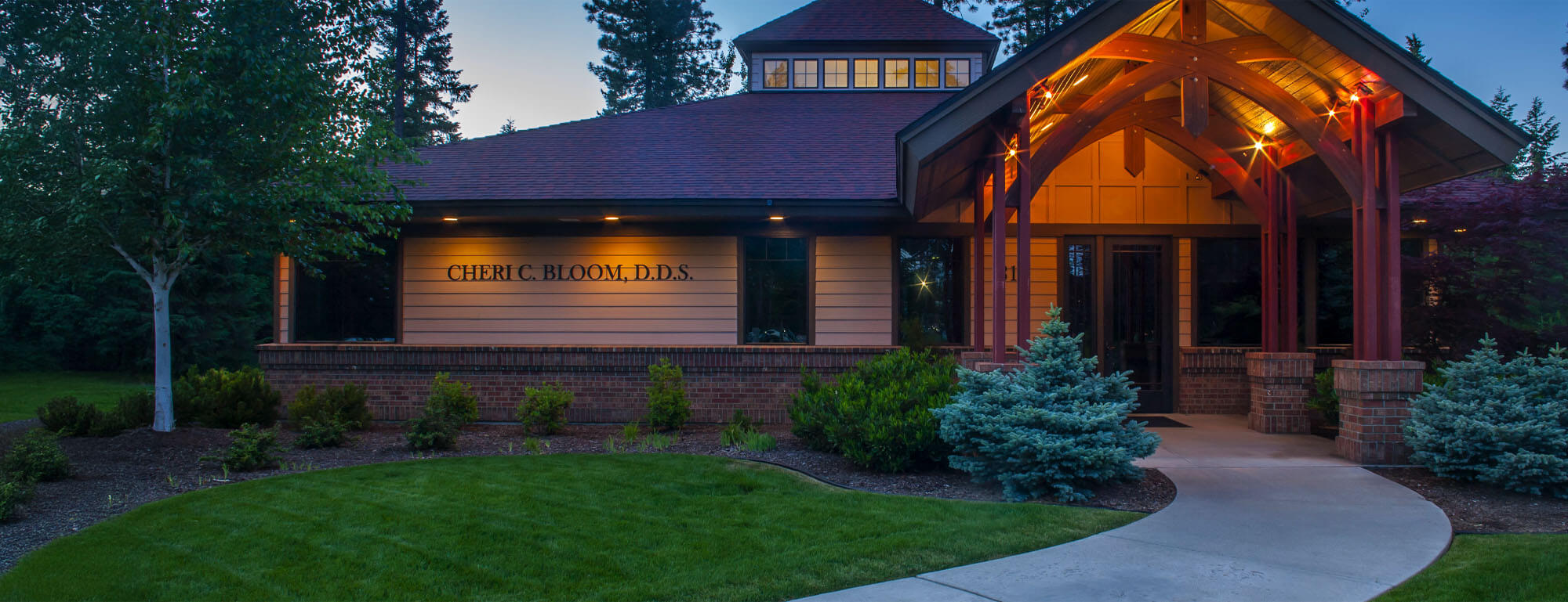Exterior entrance of Cherilee C Bloom DDS dental office in Coeur d'Alene at dusk