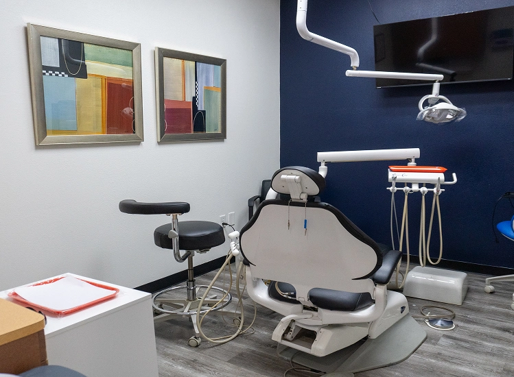 Treatment room with dental chair and equipment at Bay Colony Dental in Dickinson, TX